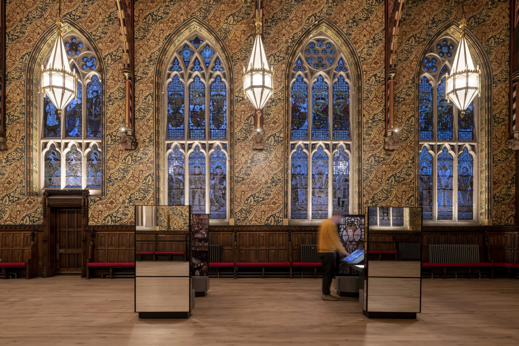 shiny visitor learning stations in an ornate hall