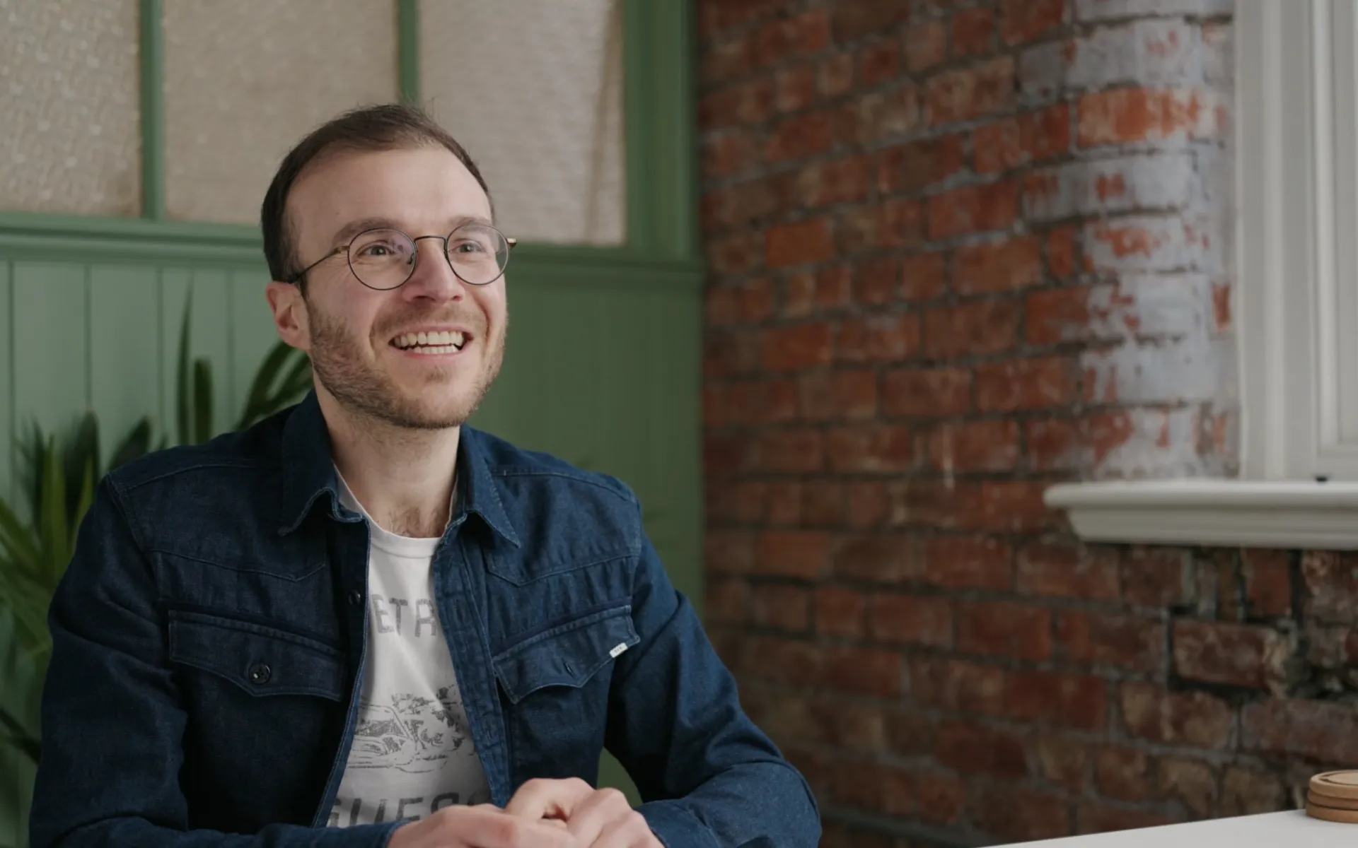 Smiling man being interviewed