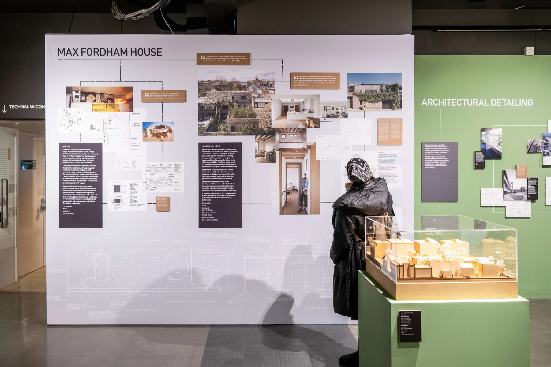 A person reading the exhibition panel