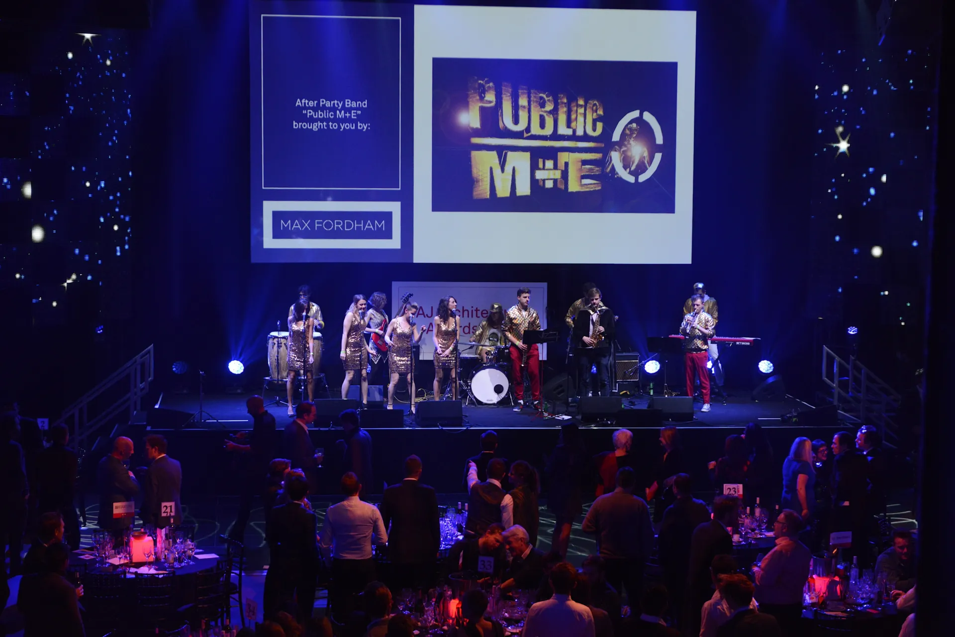 A band performing on the stage with special lighting effects