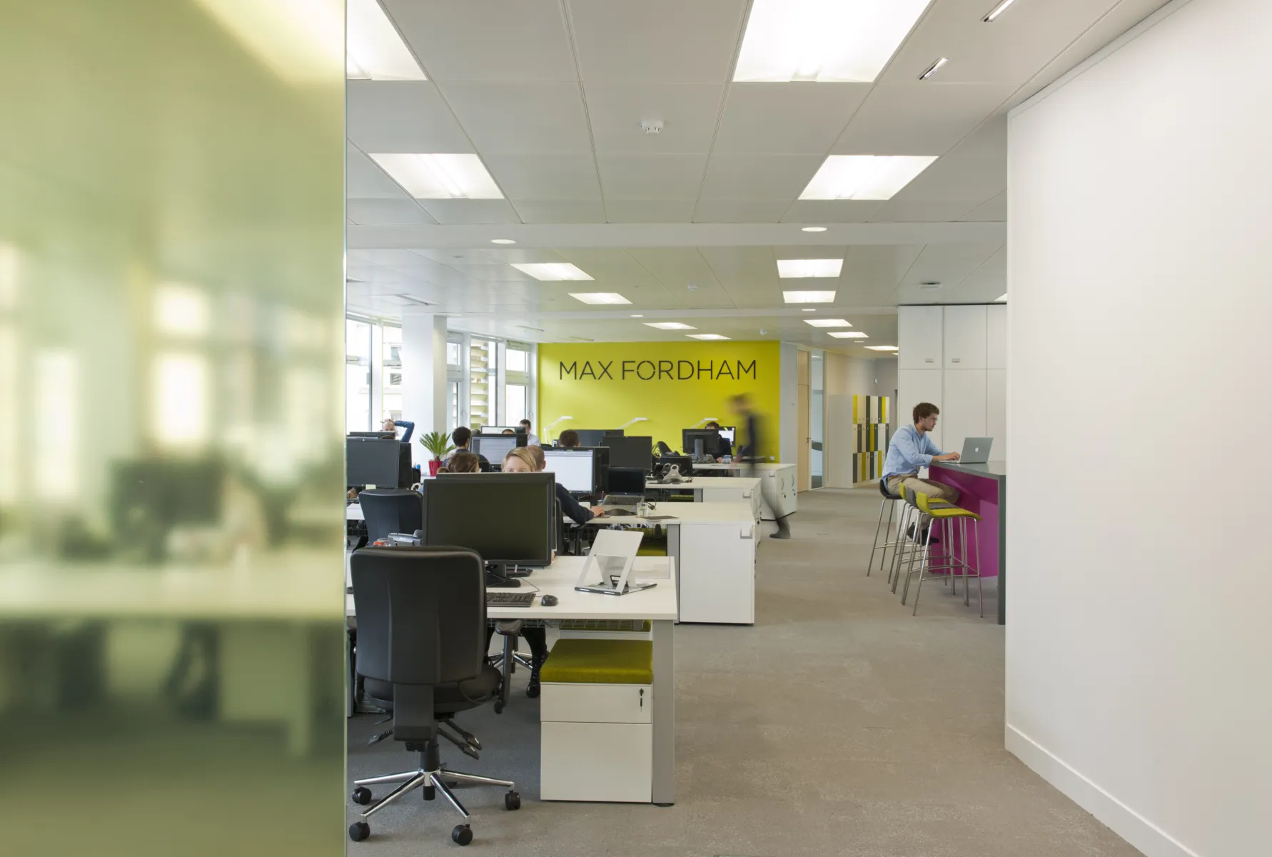 Internal photo of the Edinburgh office with accents of yellow