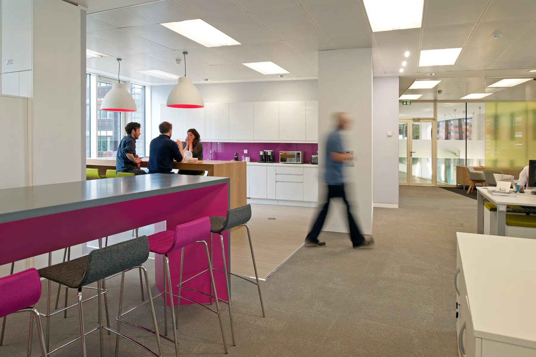 Internal photo showing raised tables and accents of pink