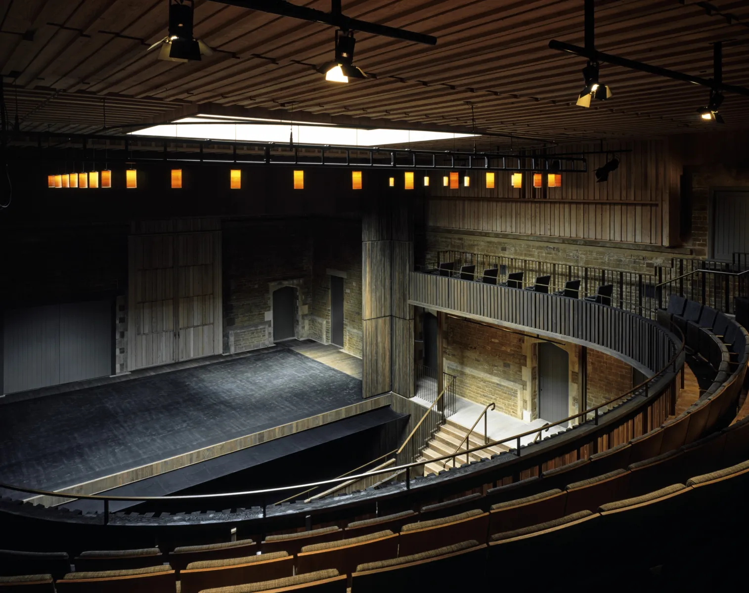 A view of the lit stage from the stalls