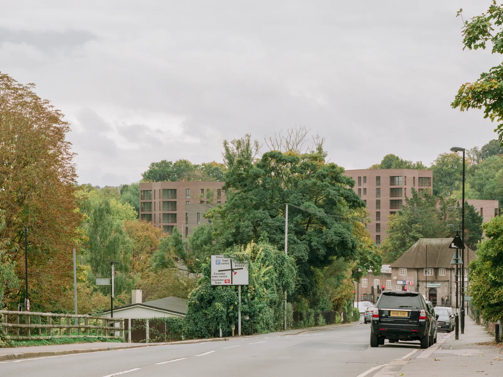 Brick buildings in the distance beyond an intersection