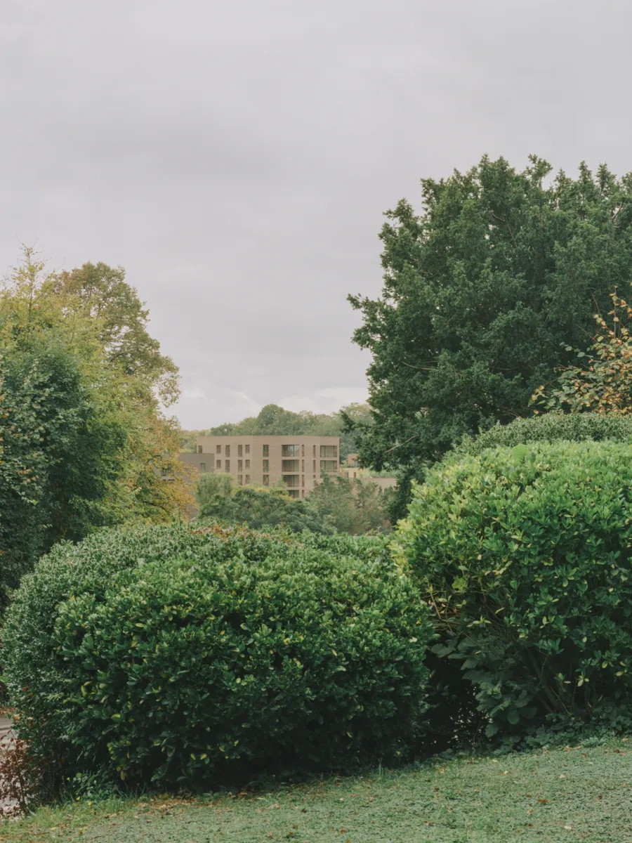 Brick buildings surrounded by greenery