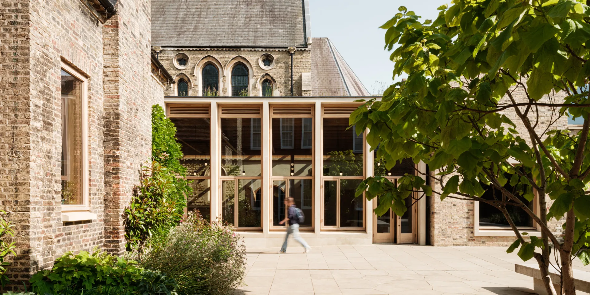 Modern wood and glass extension in historic setting
