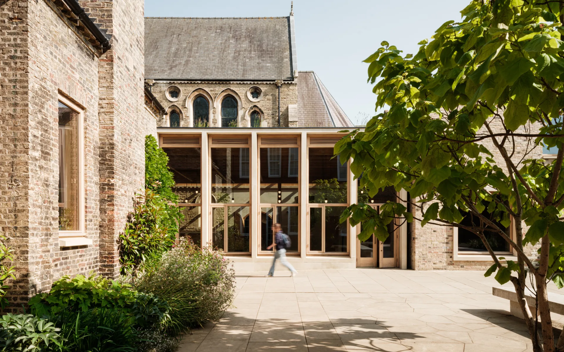 Modern wood and glass extension in historic setting