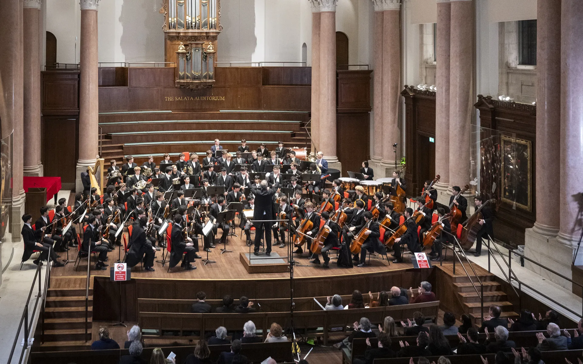An orchestral concert taking place in the newly renovated hall.