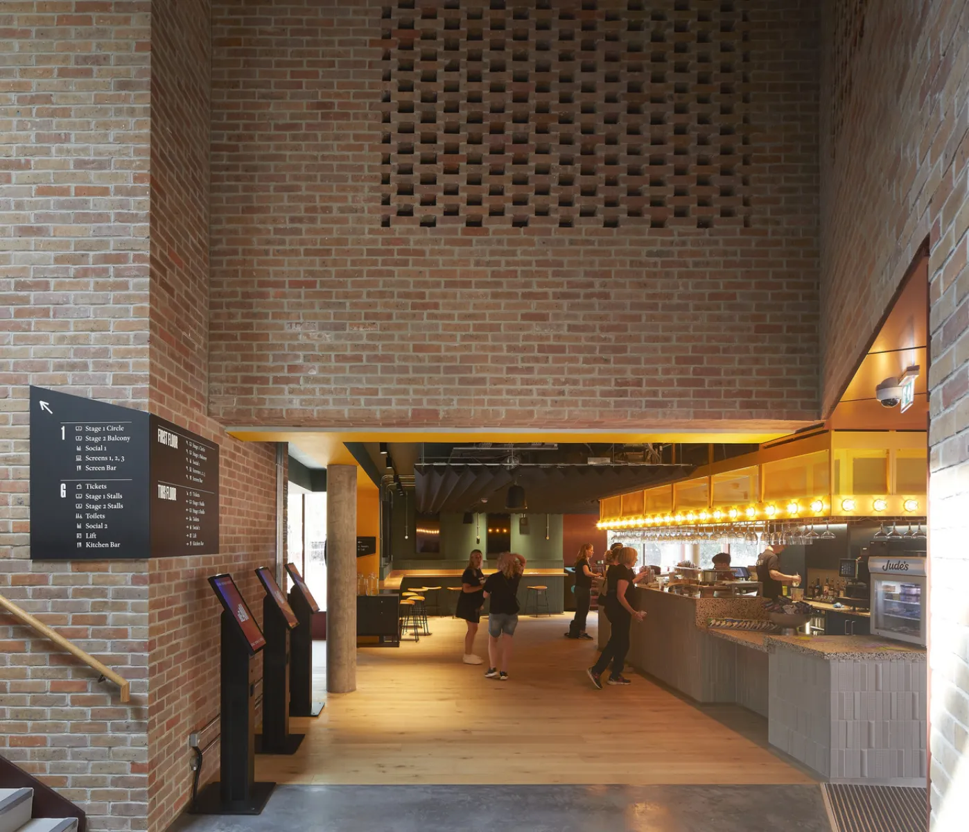 Interior photo of a brick building showing the bar area