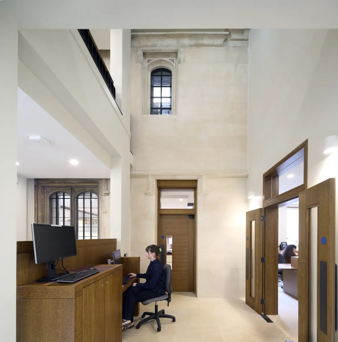 Person sitting at a reception desk