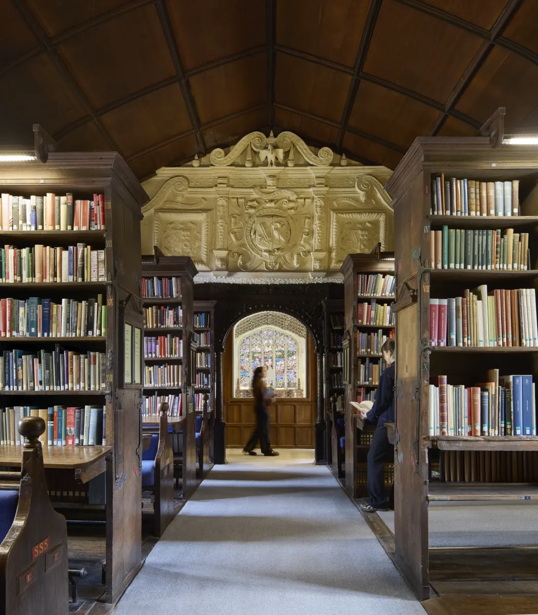Old, historic library with books on shelves