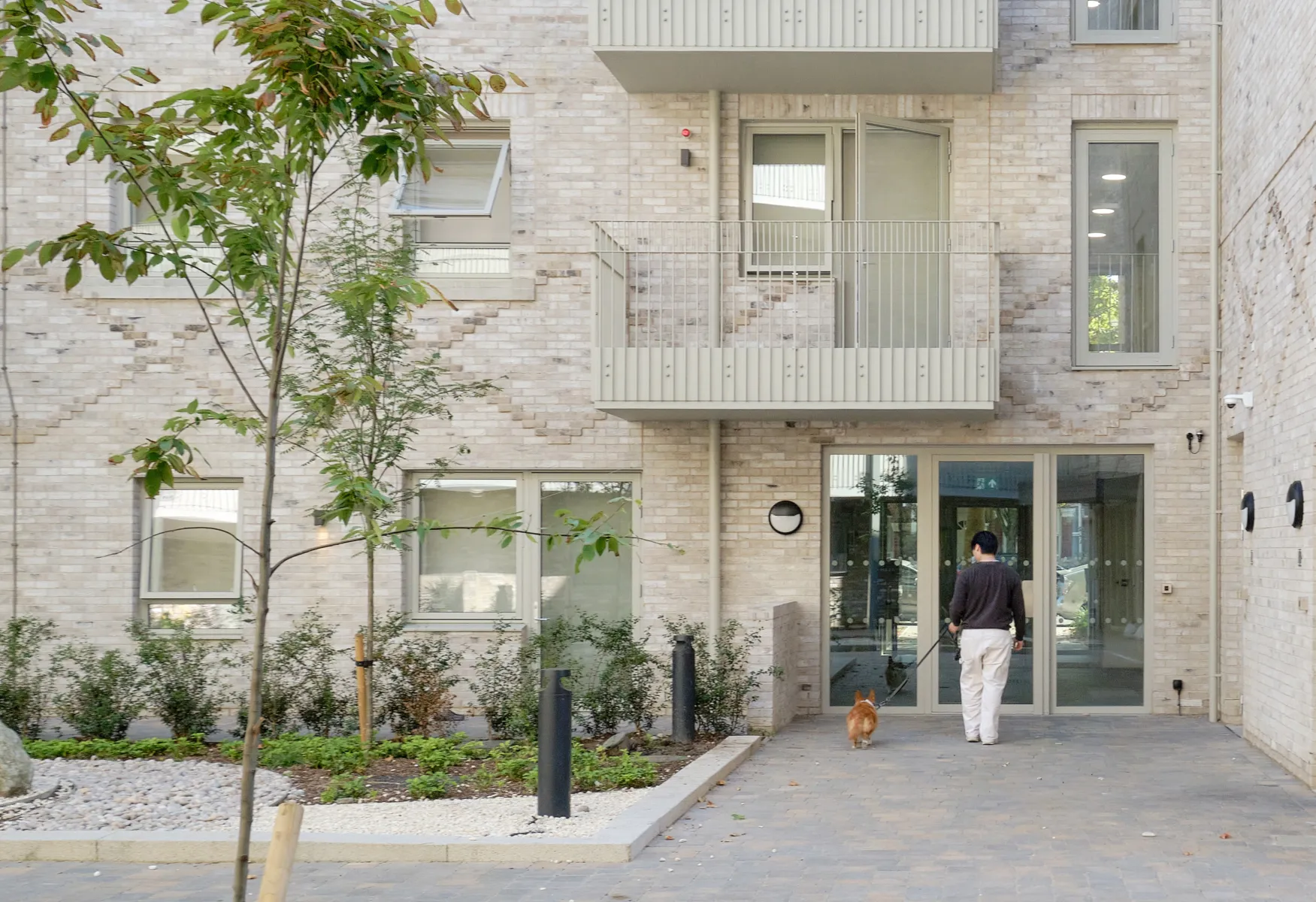 Light brick facade and inviting entrance on a residential housing scheme