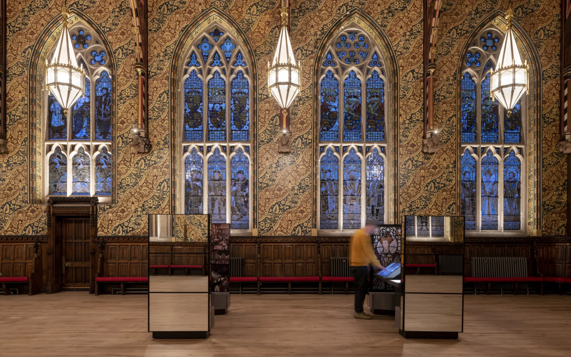 Decorative pendant lighting in a highly-decorative interior hall