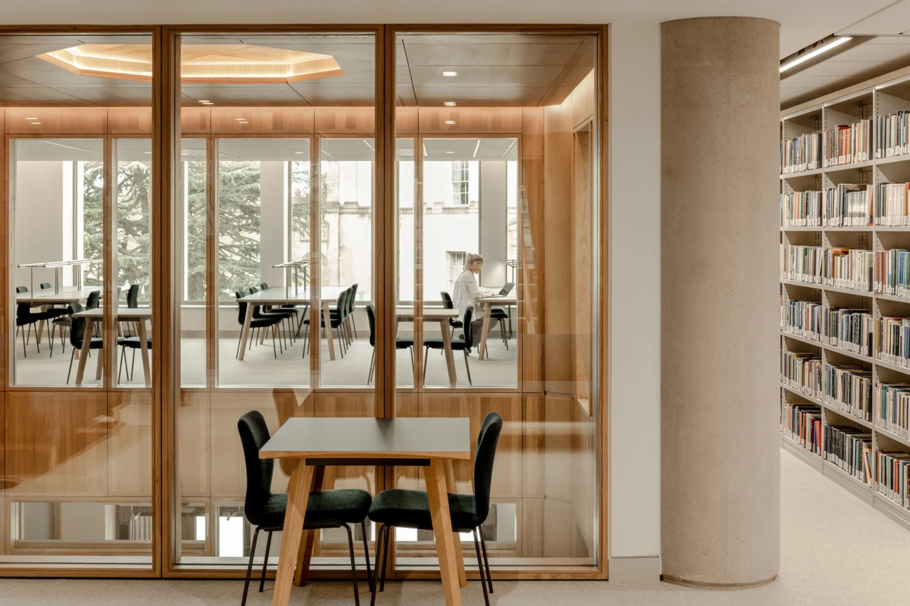 tables and chairs shown in modern library