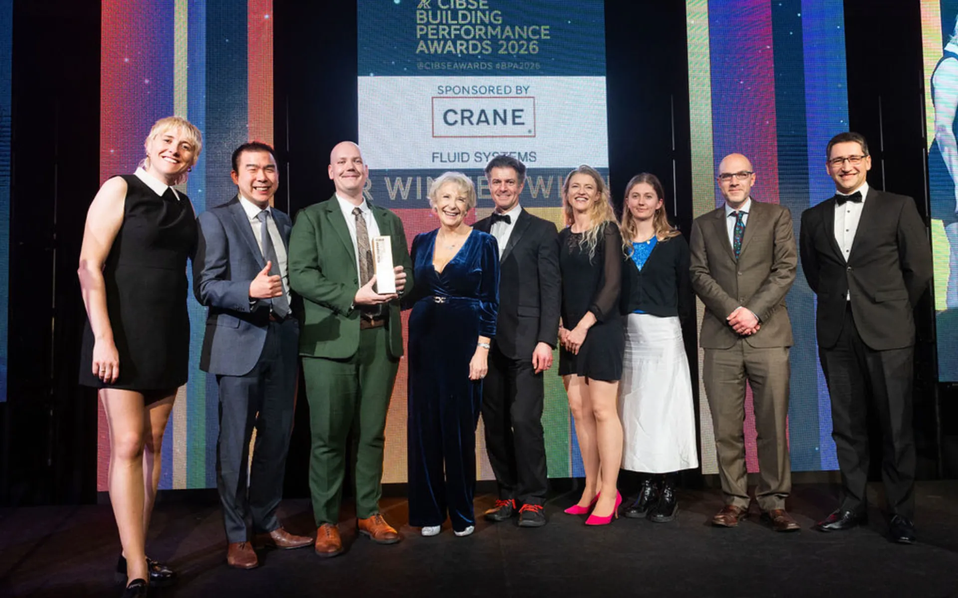 People standing on a stage at an award ceremony