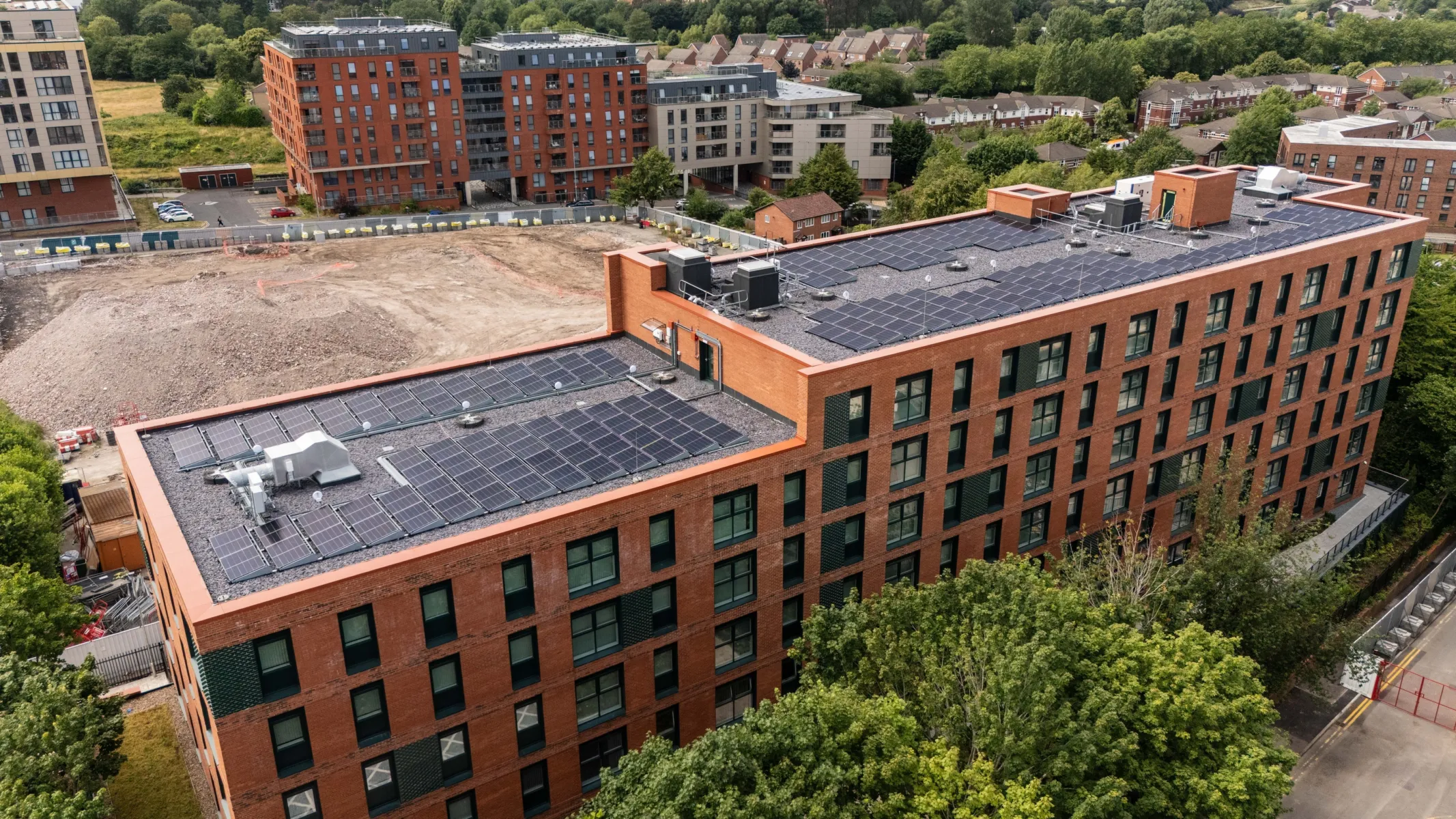 Aerial view of the Willohaus residential development showing rooftop solar panels and surrounding neighbourhood.