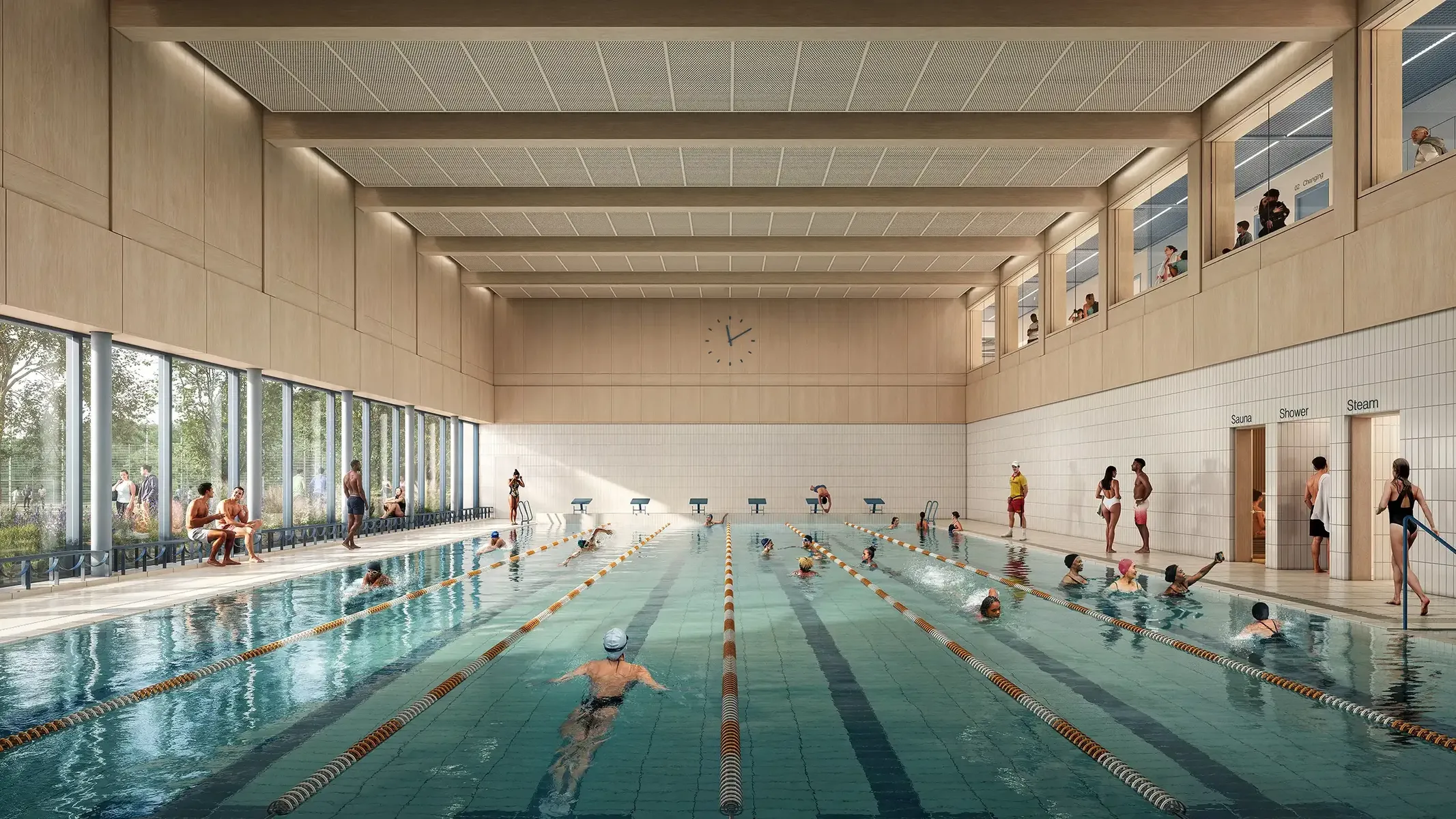Indoor swimming pool with lap lanes and people using the facility.