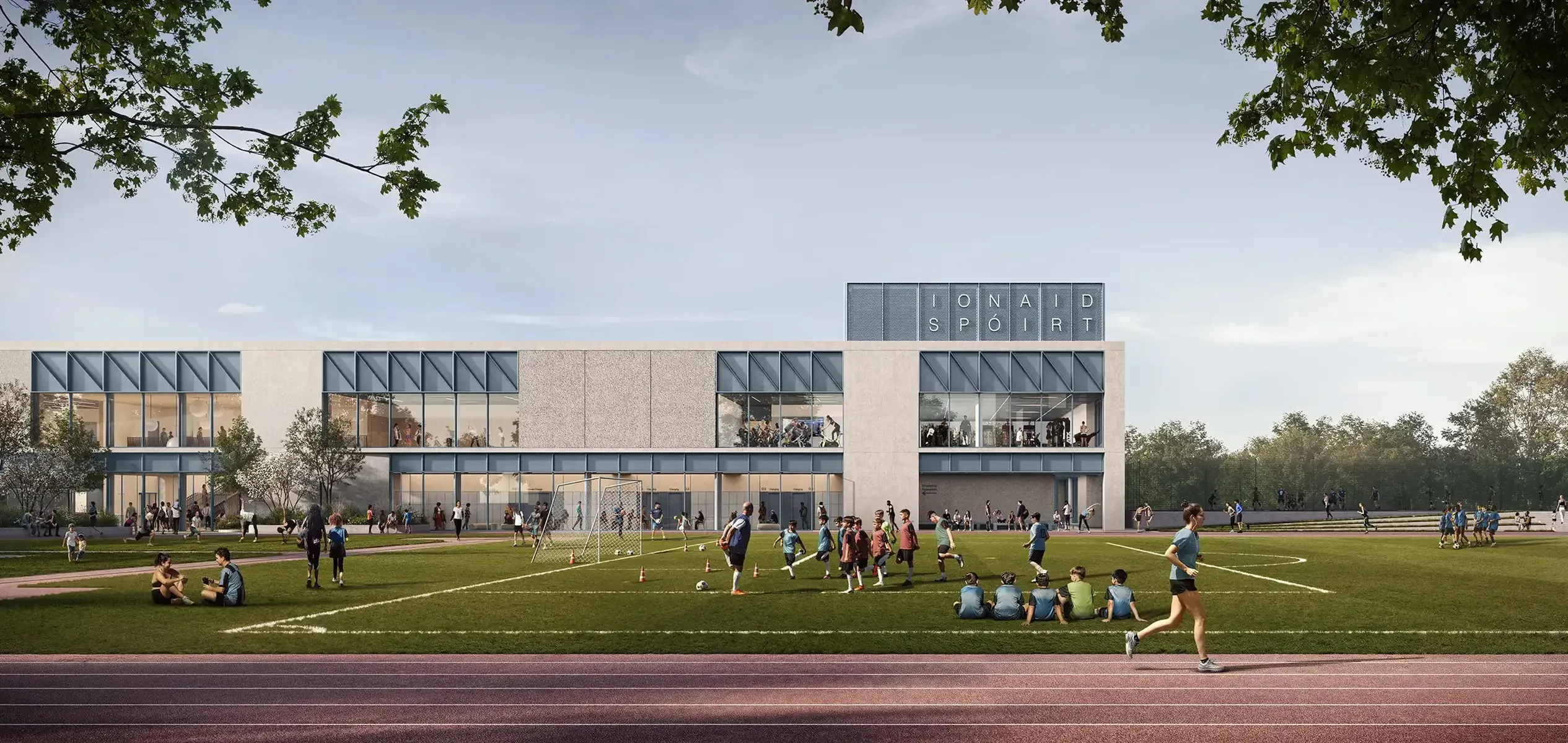 Sports centre beside football pitches, running track and outdoor activity areas.