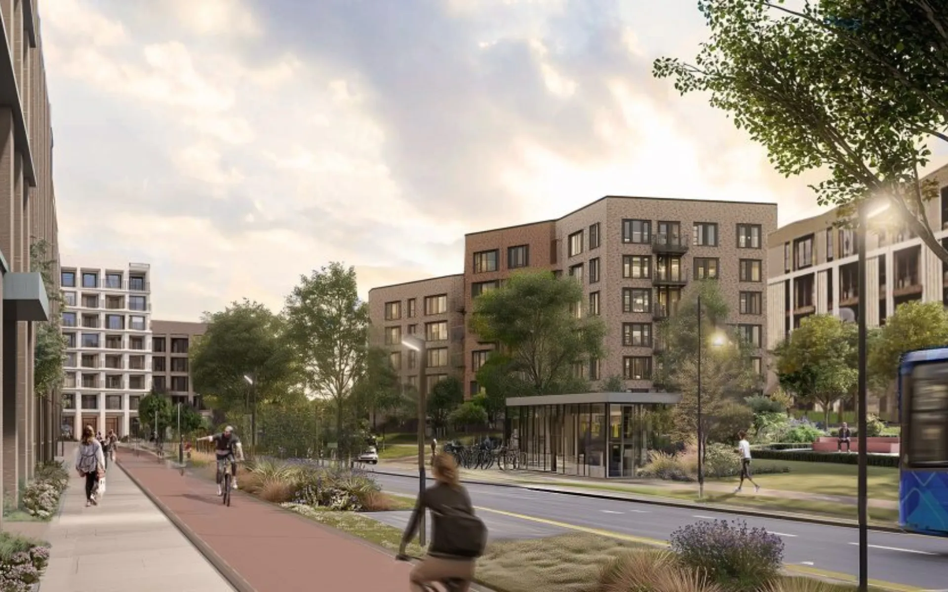 Landscaped residential street with apartments, cycle lane, trees and active public spaces.