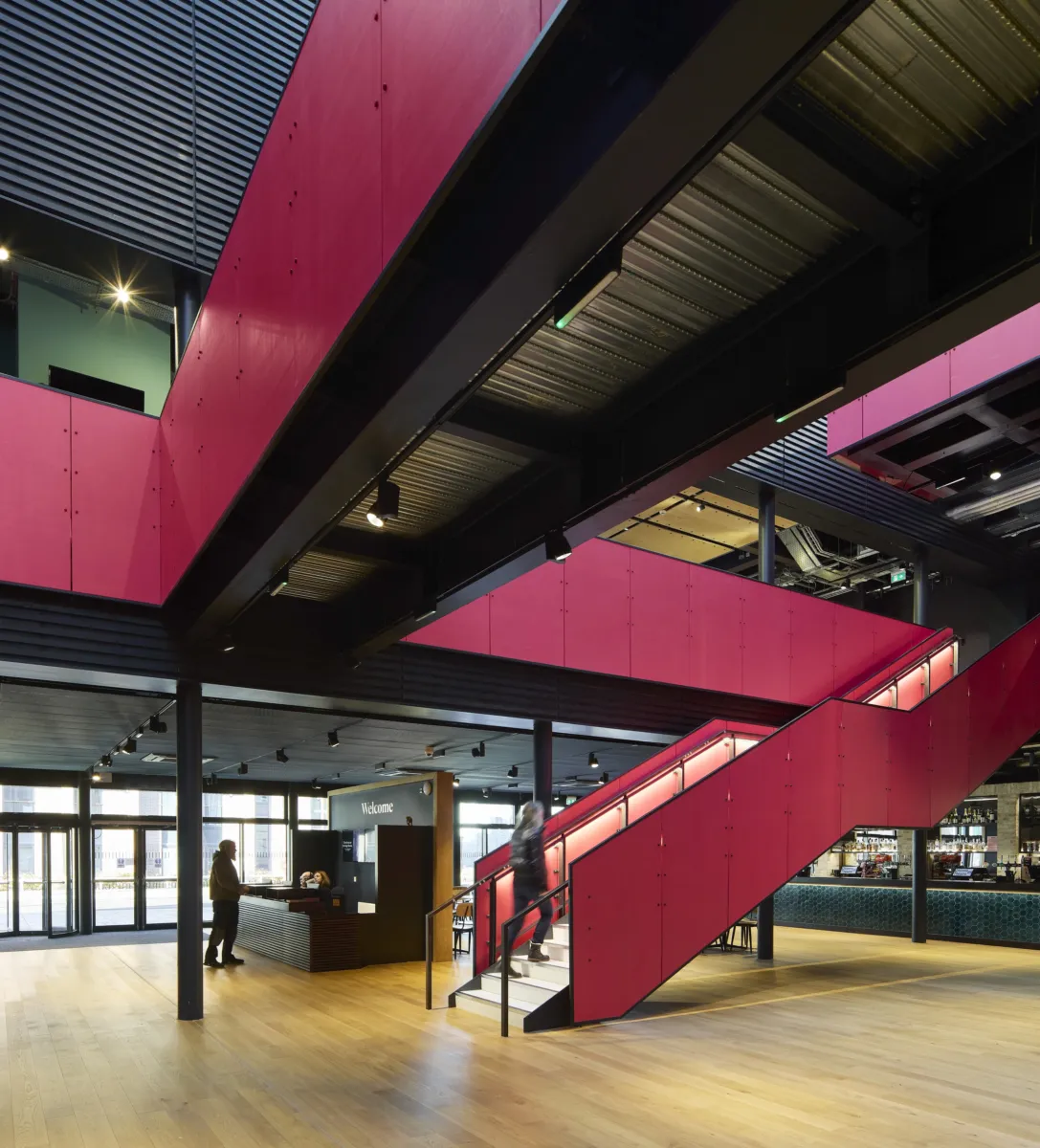 pink staircases zig zag around a room