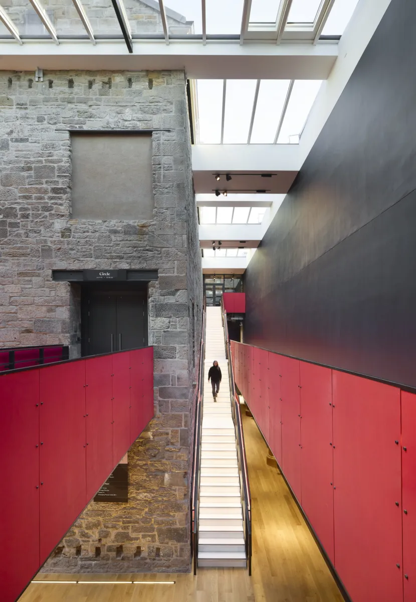 pink walkways across a large room and skylights