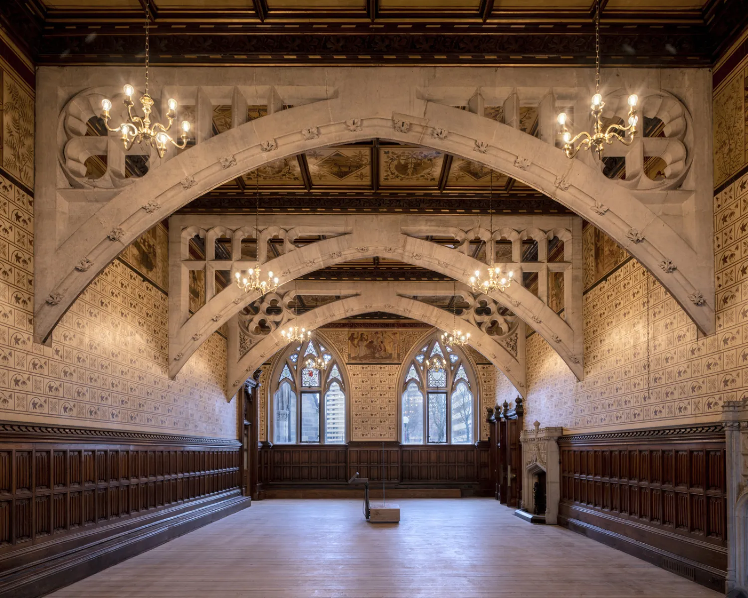 Wooden, highly decorated arches in an historic room