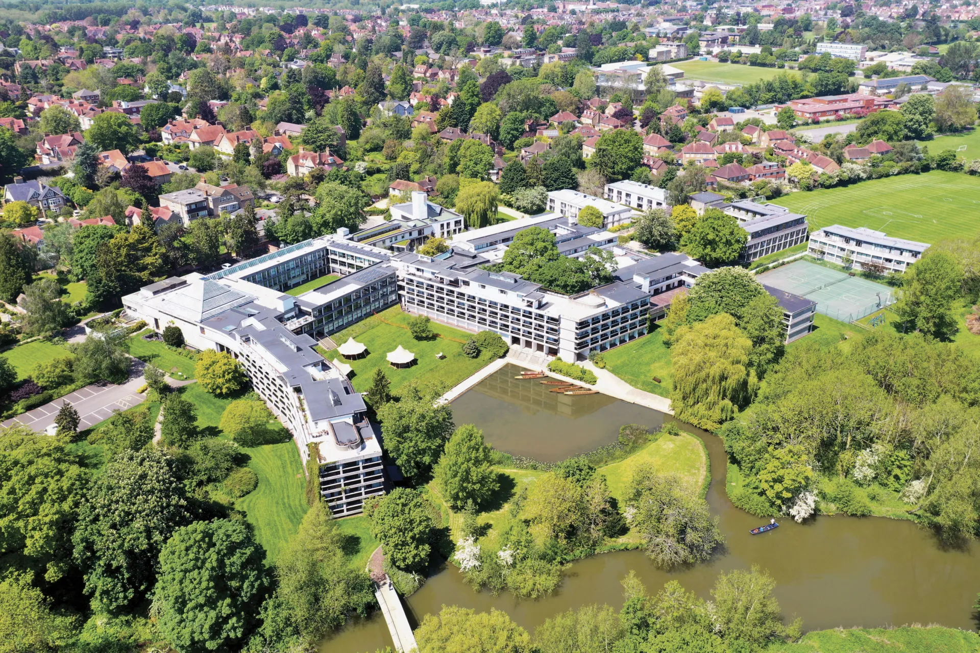 An ariel view of buildings and greenery space