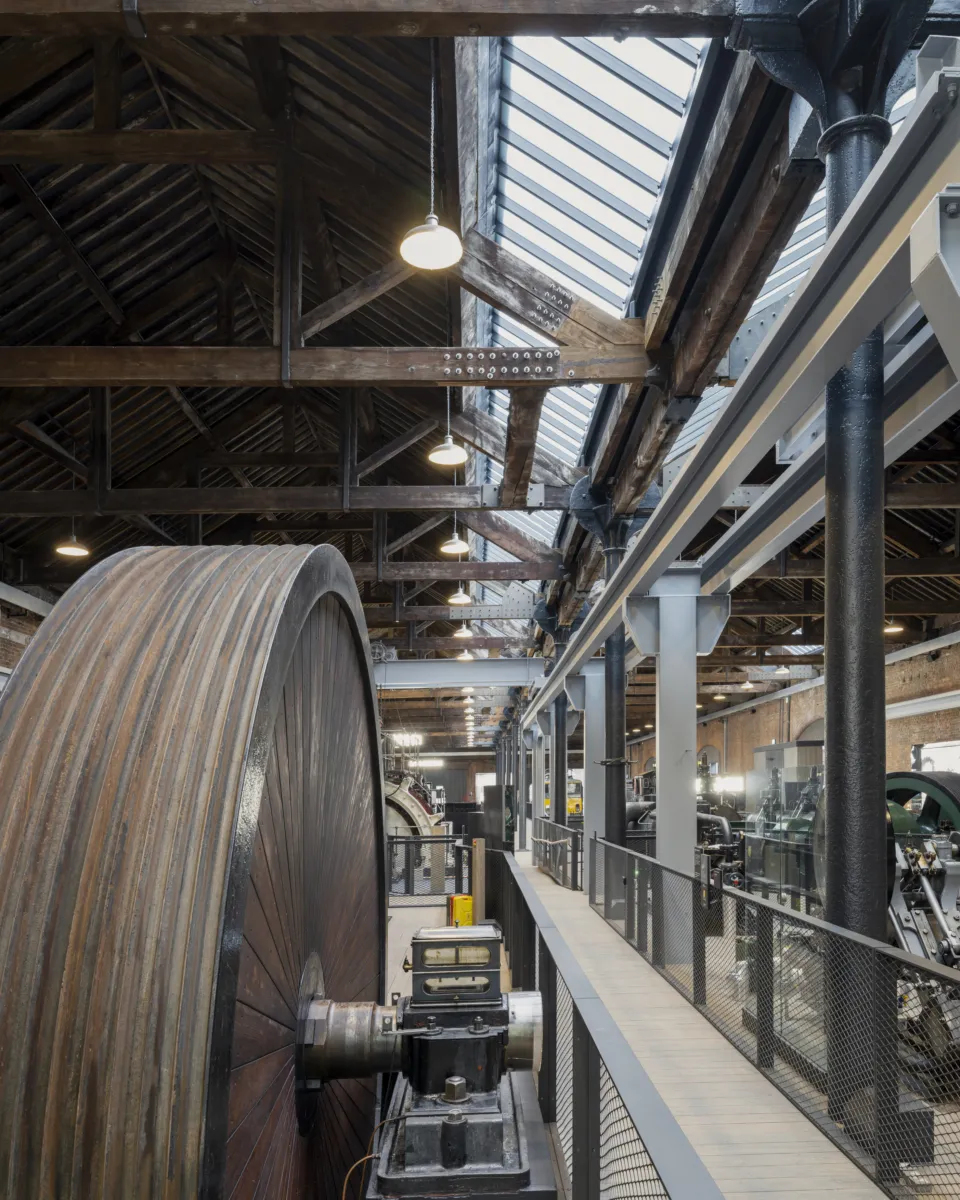 Showing a giant flywheel and newly double-glazed and insulated roof providing natural light, and upgraded LED lighting in the Power Hall.