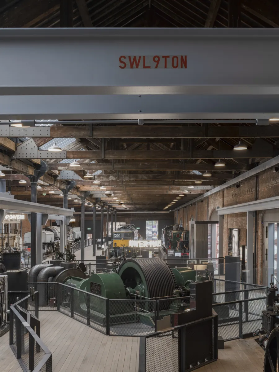 A view looking down the Power Hall, showing a steel beam overhead, with red writing showing it can bear 9 tonnes.