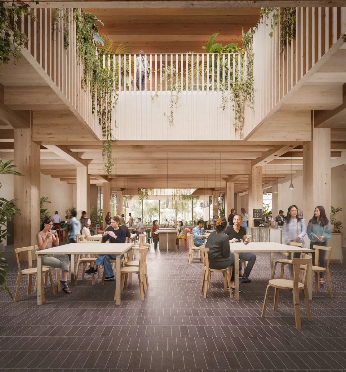 Image shows tables and chairs with people dining in a large communal indoor area. There are balconies with plants hanging down