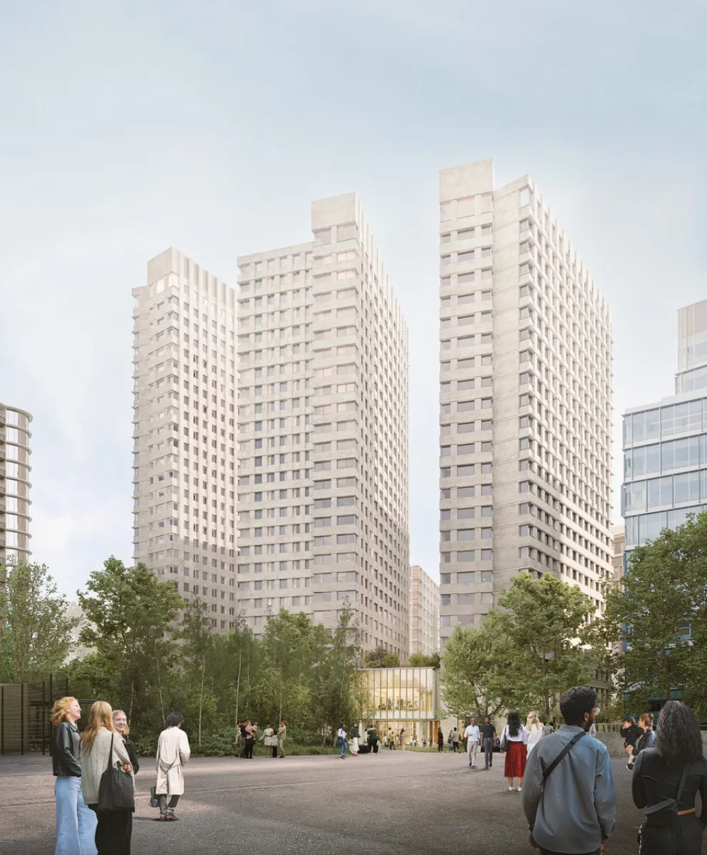 Three tall, light‑coloured residential towers rising from a new urban square, with people walking and gathering at ground level among trees and planting under a pale sky.