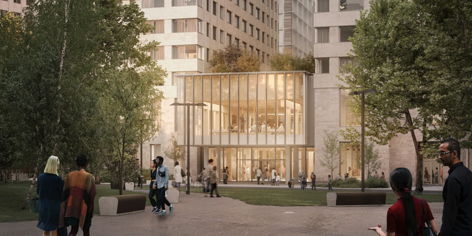 Image shows people in front of a glass fronted building. Large towers are next to and behind.