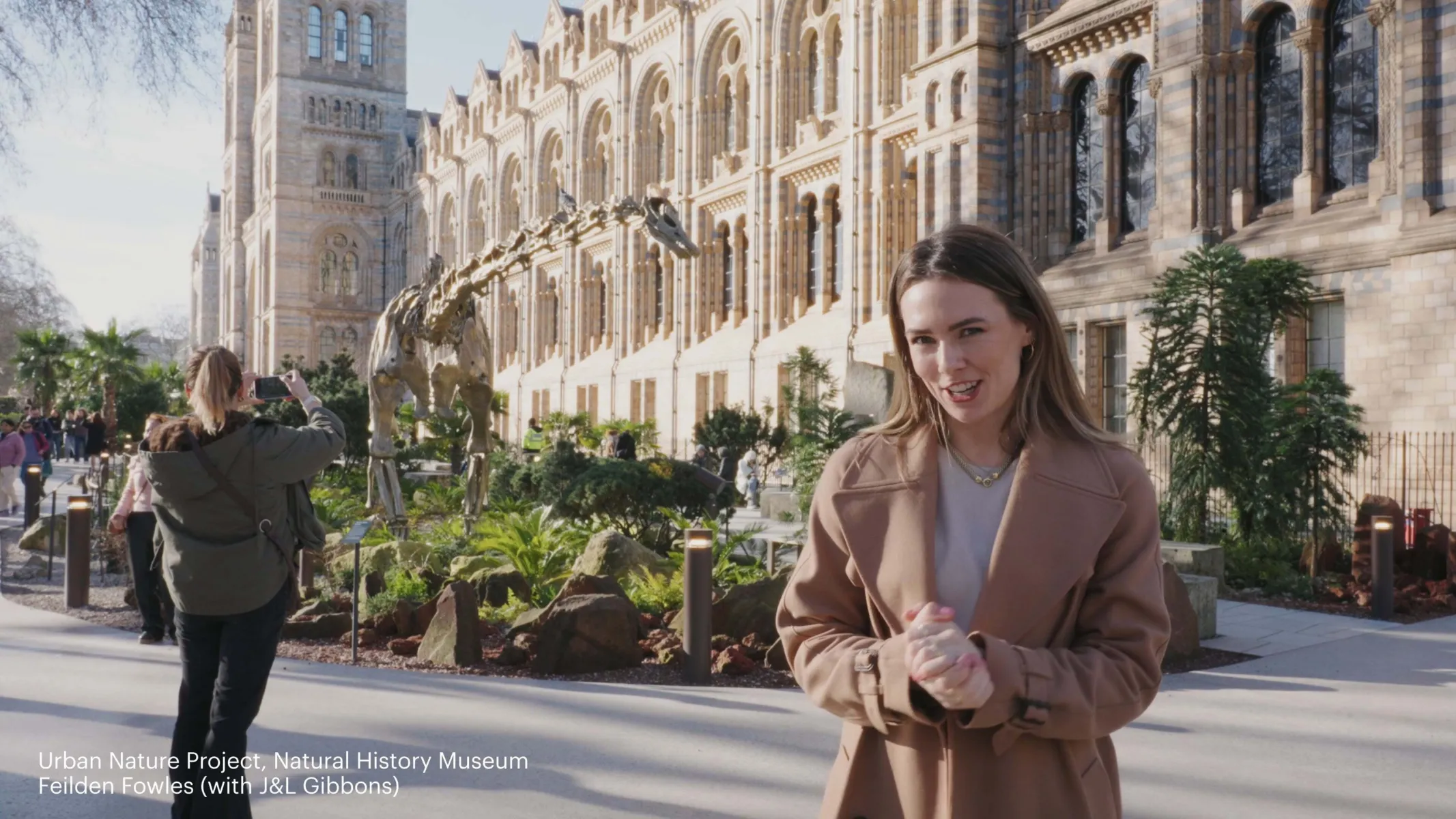 Imogen in the garden at Natural History Museum, with Fern in the background