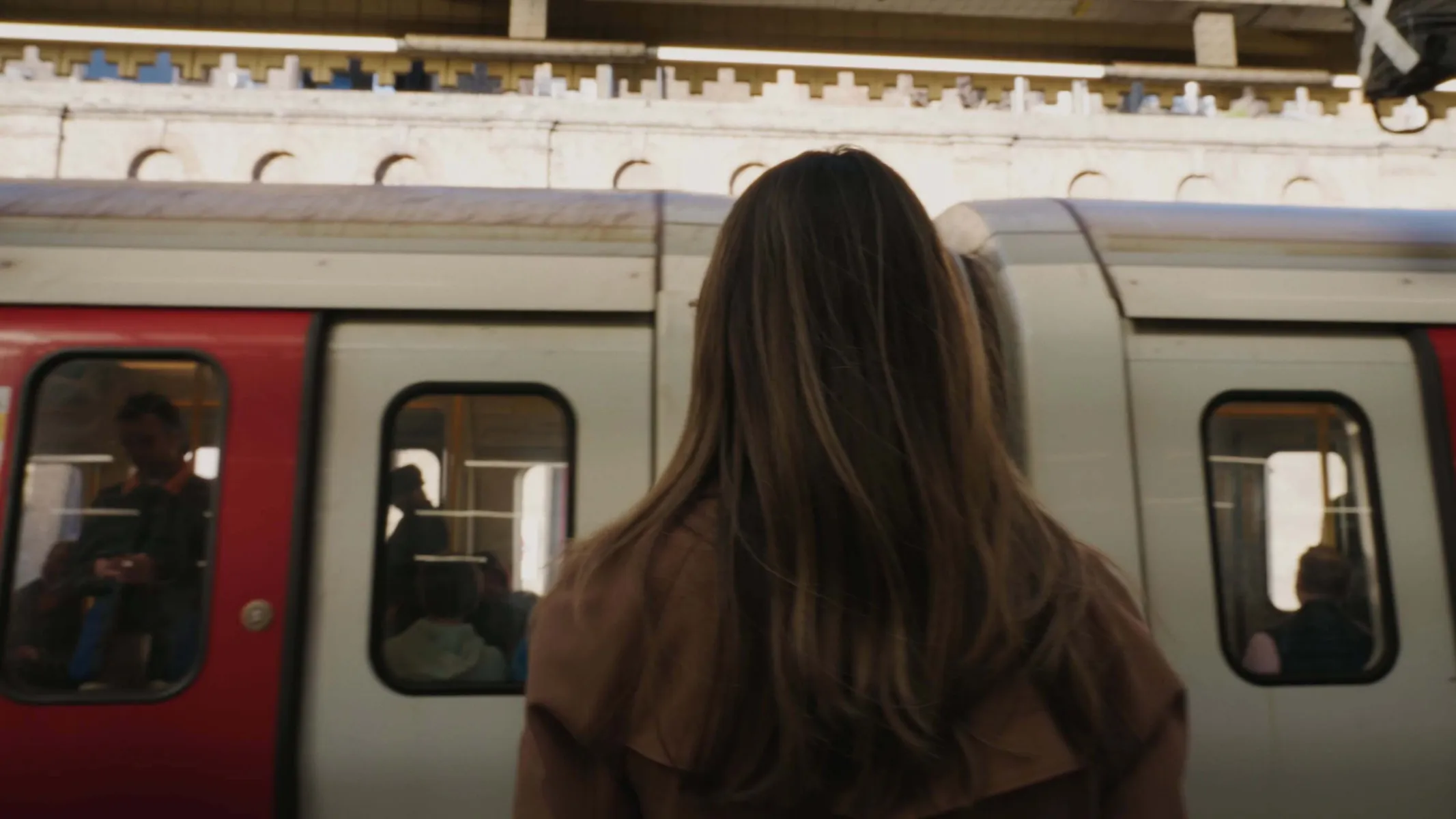 Woman waiting to board a tube
