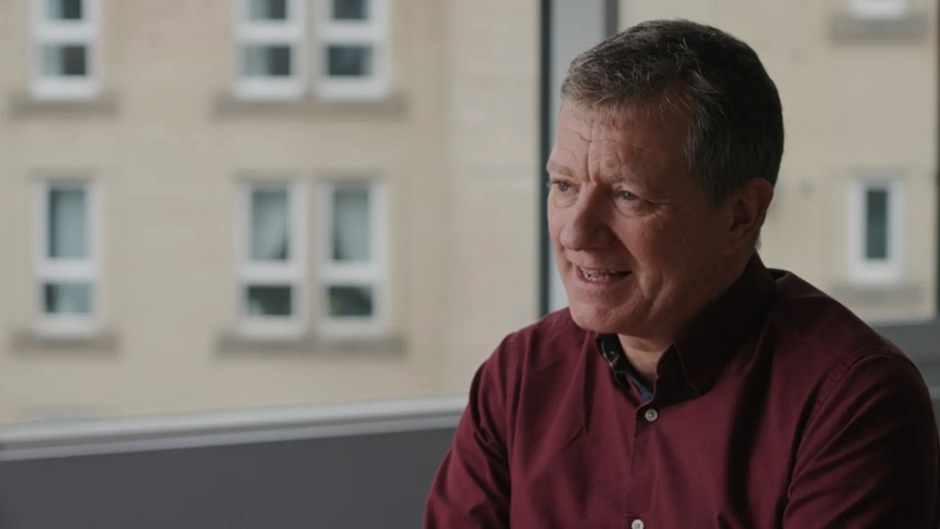 man speaking to someone off camera