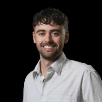 A headshot of Jacob Bridge wearing a white shirt